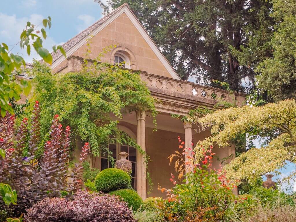 Beautiful georgian building in Bath UK surrounded by a lush green garden. One of 10 reasons to visit Bath UK