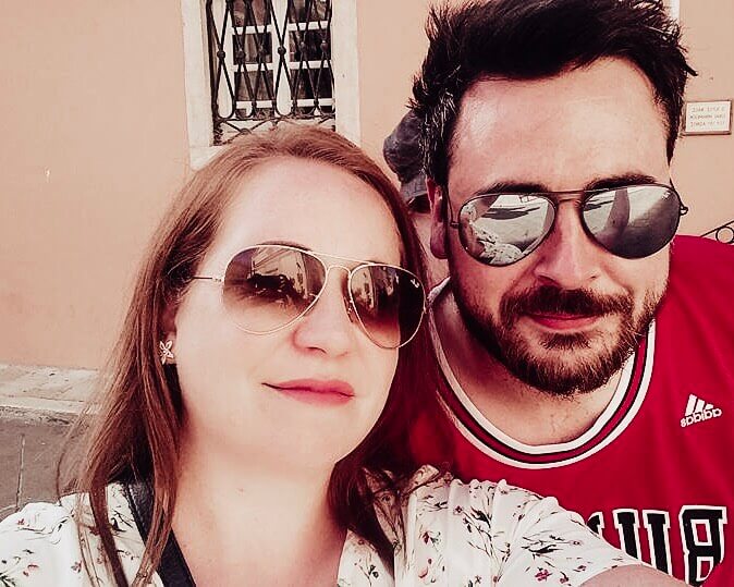 Couple taking a selfie on holiday in Corfu and why it is impoartant to have travel insurance while travelling