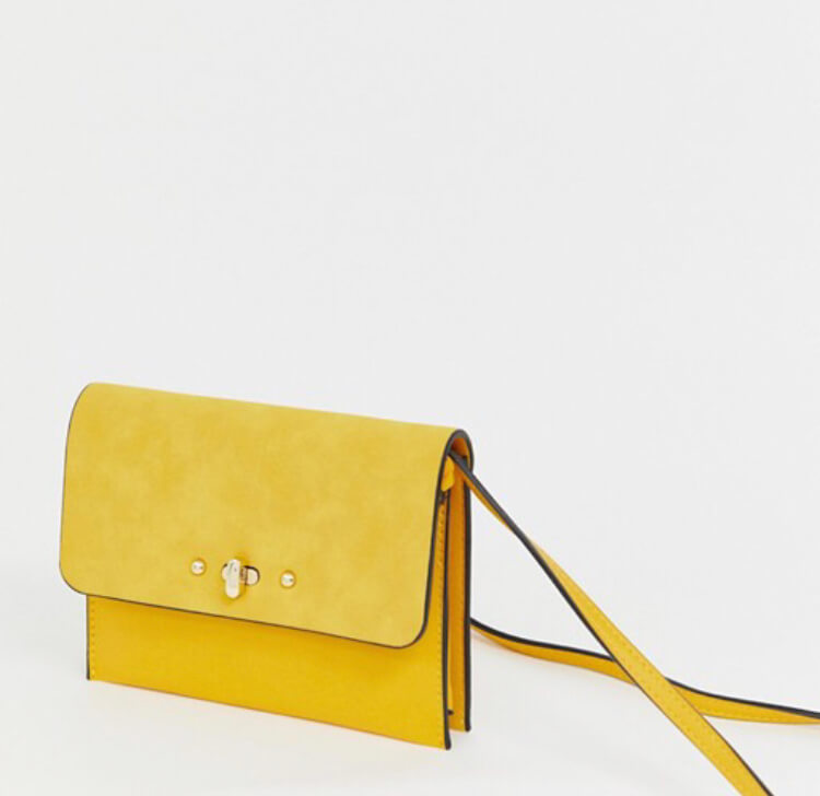 Accessorize yellow cross body bag.