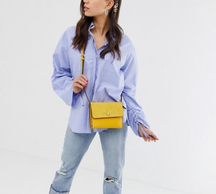 Accessorize yellow cross body bag.