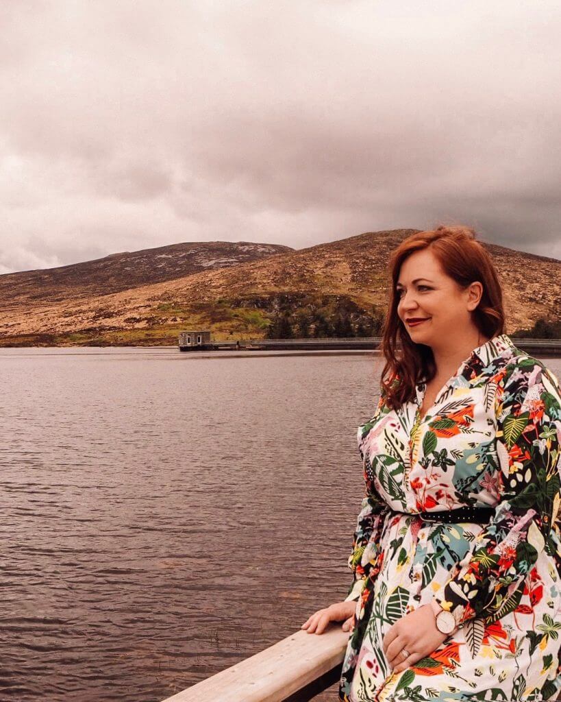 girl looking at a lake in northern ireland