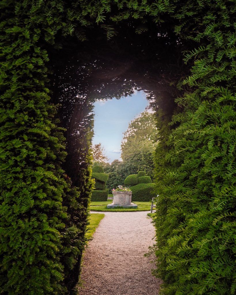 The entrance to the topiary garden at Billesley Manor. Read more on www.ouruniquestays.com