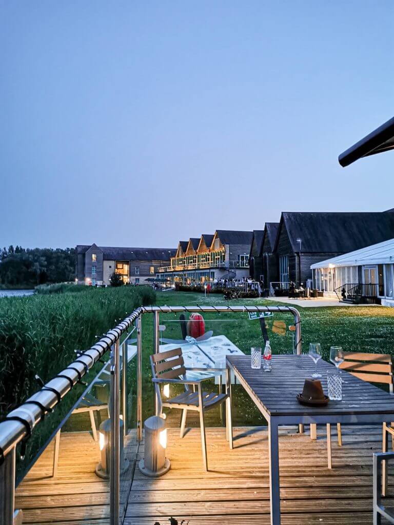 PiNight views of the lake at De Vere Cotswolds Water Park Apartments. Read more on www.ouruniquestays.com