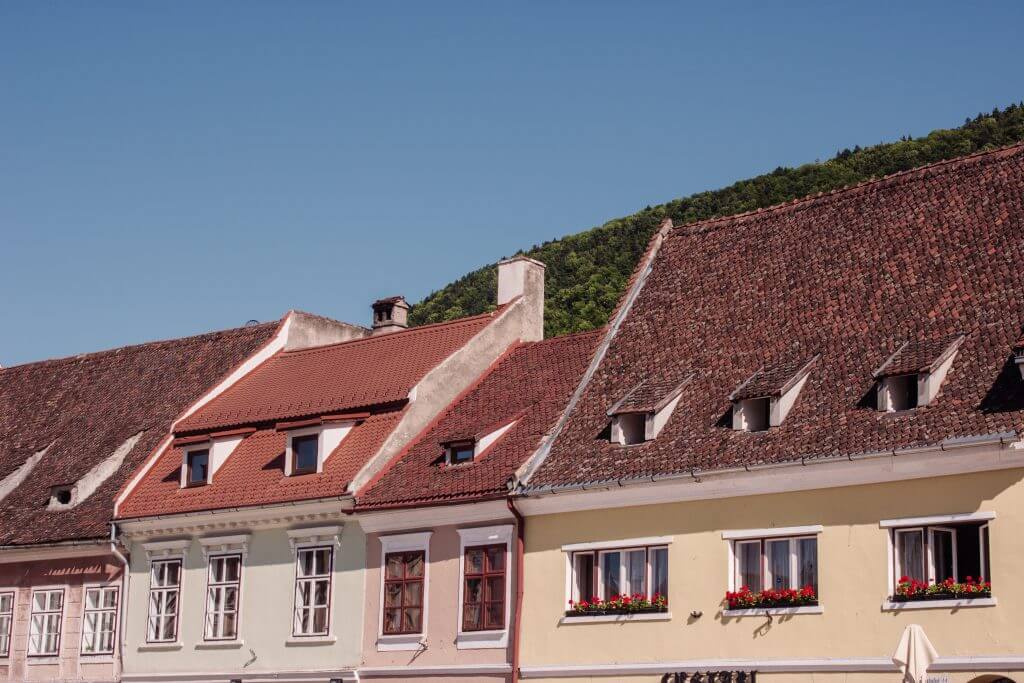 Colourful houses in Romania. Read more on www.ouruniquestays.com