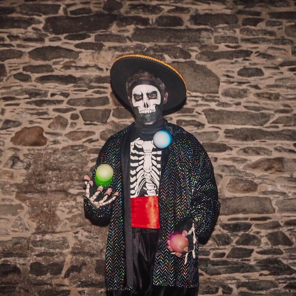 Street performer at the Awakening of the Walls. Celebrate a Derry Halloween in Ireland one of the best places for Halloween