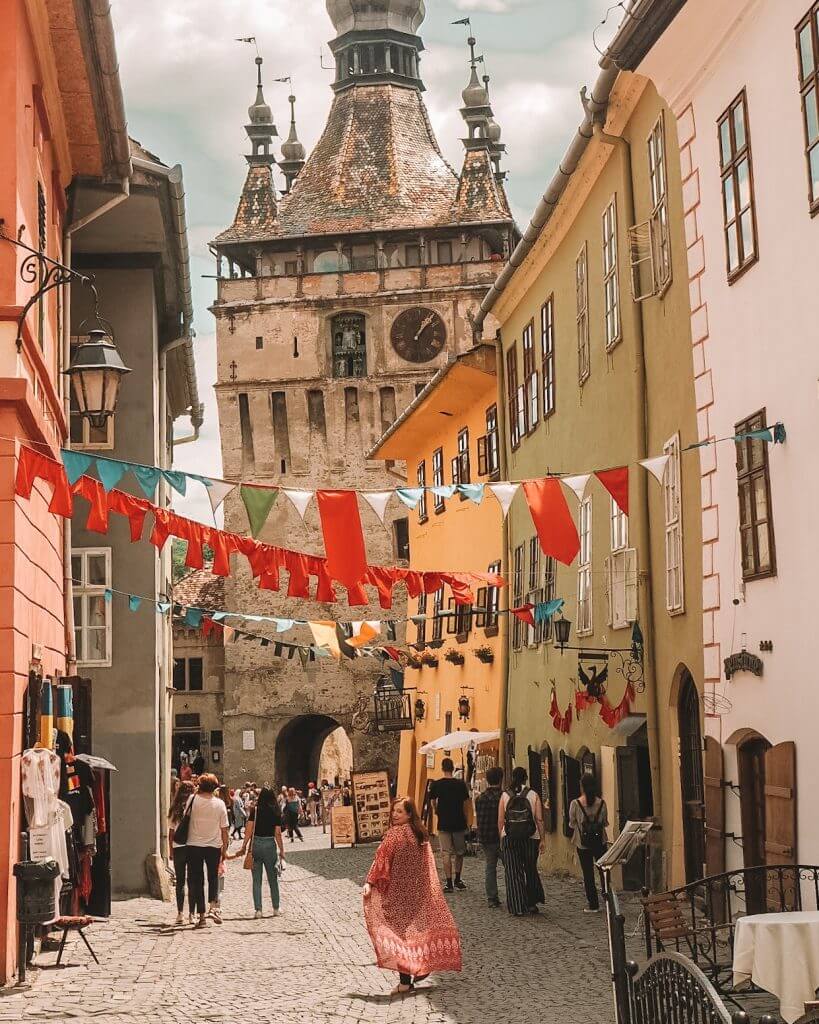 The colourful streets of Medieval Sighisoara in Transylvania Romania.
