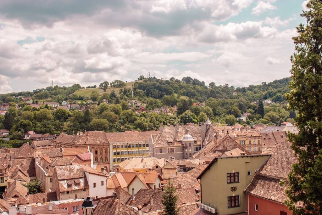 The colourful streets of Medieval Sighisoara in Transylvania Romania.