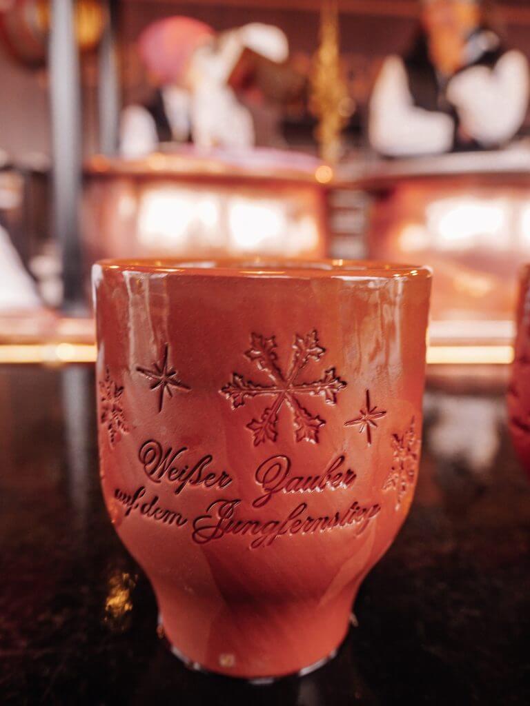 Traditional Feuerzangenbowle an alcoholic drink for which a rum-soaked sugarloaf is set on fire and drips into mulled wine