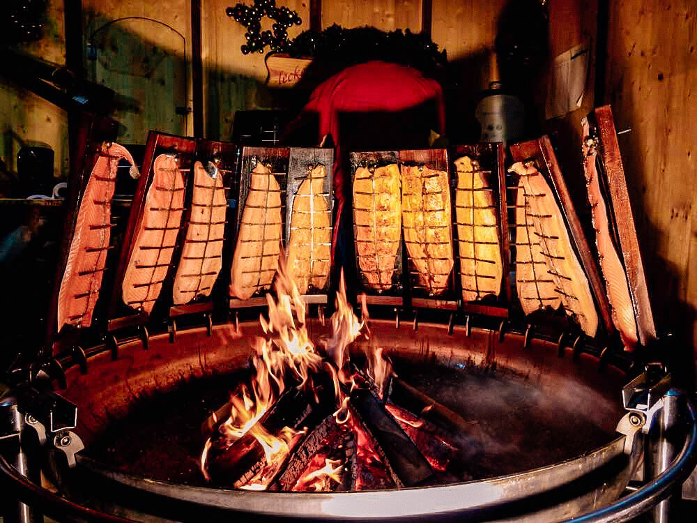 Smoked Salmon roasted over an open fire in Hamburg Christmas Markets