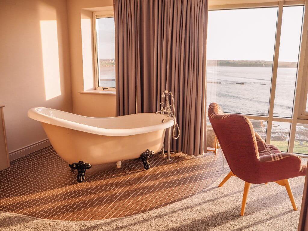 Roll top bath in the middle of a hotel room in Armada Spanish Point Hotel