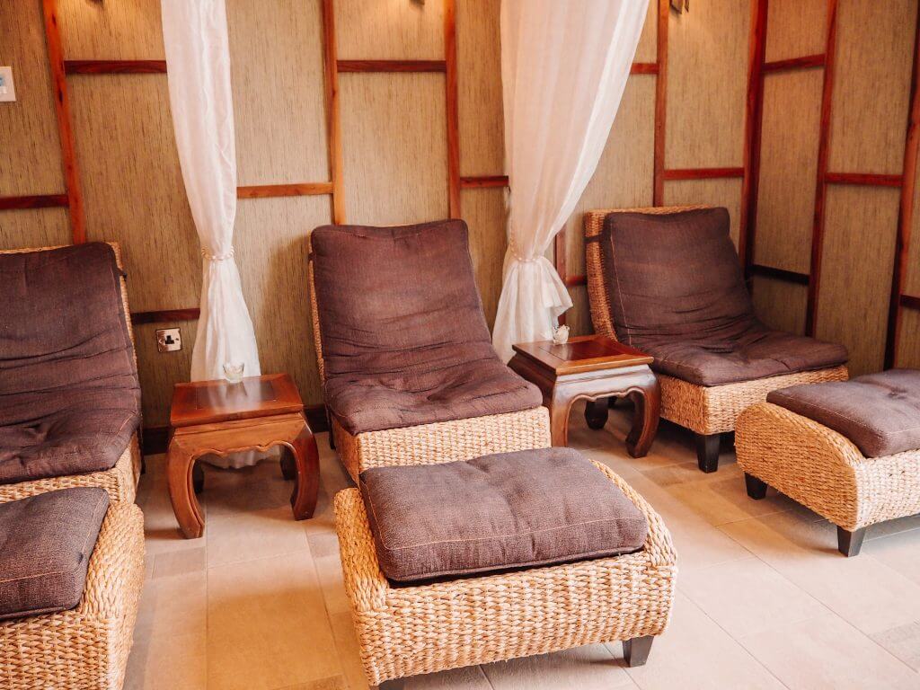 Relaxation area of the Thai Spa in one of Ireland's most luxurious hotels Lough Erne. Relaxation chairs with foot stools with each area separated by a net curtain.