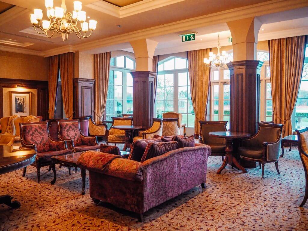 Plush velvet purple couch in the lobby of a hotel