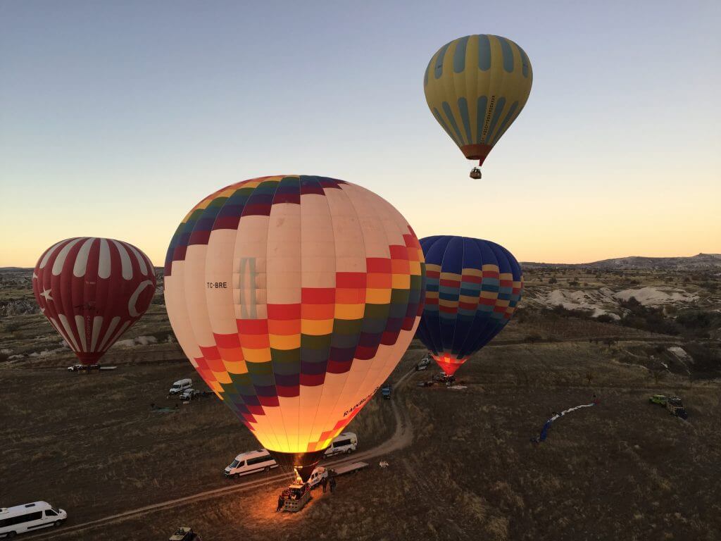 Hot air balloons rising over Cappadocia Turkey