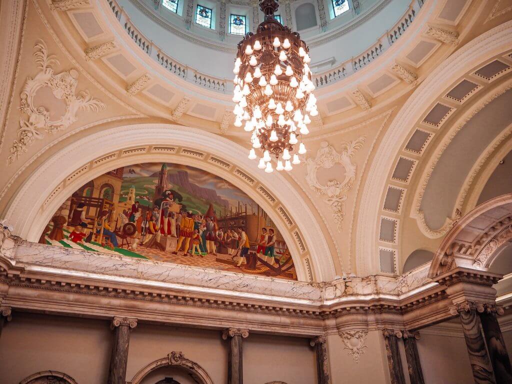 Interior of Belfast City Hall with a beautiful chandelier hanging over the grand staircase