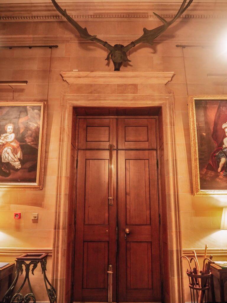 Entranceway of Hillsborough Castle in Northern Ireland with Elk skull over doorway