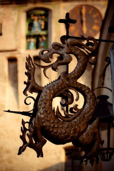 Telephoto detail of a dragon sculpture close to the clock tower in Sighisoara, Transylvania, Romania