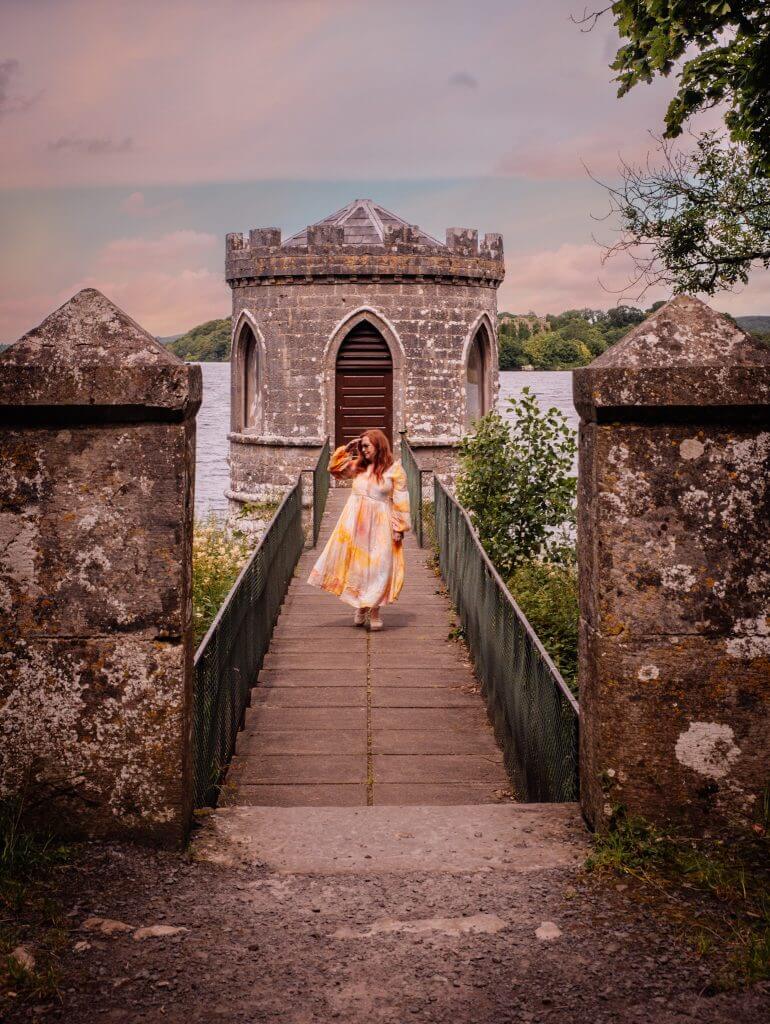 Woman walking along a lake in Ireland