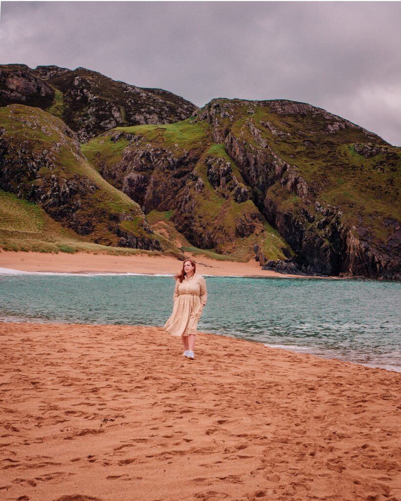 Woman with a chronic illnesswalking on a beach in Donegal Ireland during her staycation in Ireland