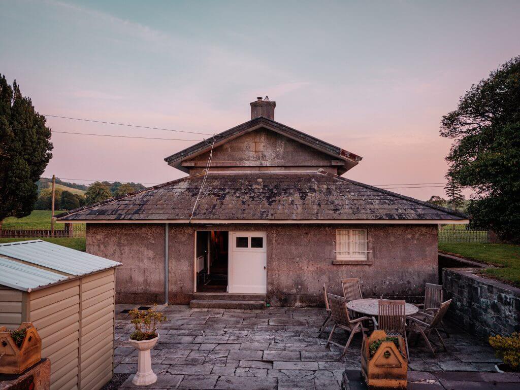 Courtyard at Loughcrew Lodge with wooden table and chairs for al fresco dining