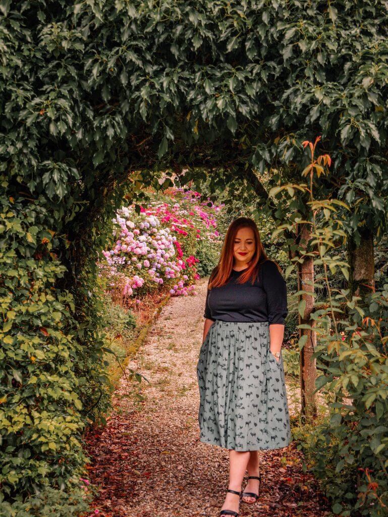 Woman walking through the gardens at Dunmore House Carrigans Donegal