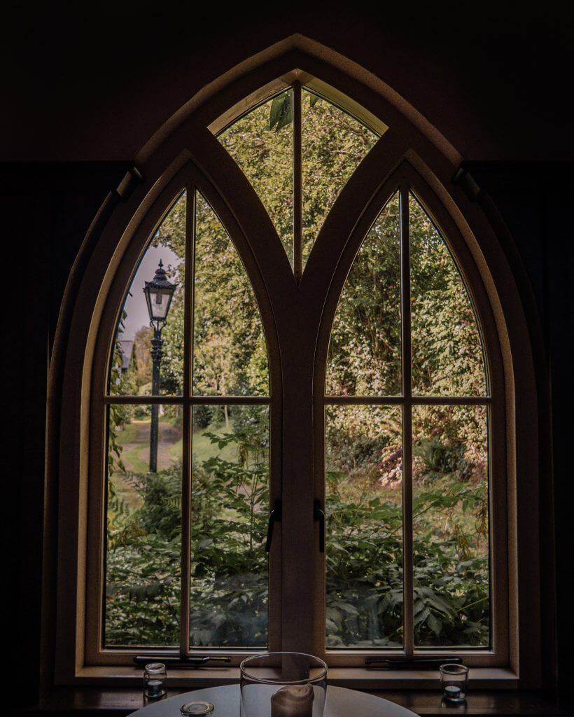 View of a lampost and trees through a window at Brooklodge Hotel Wicklow Ireland