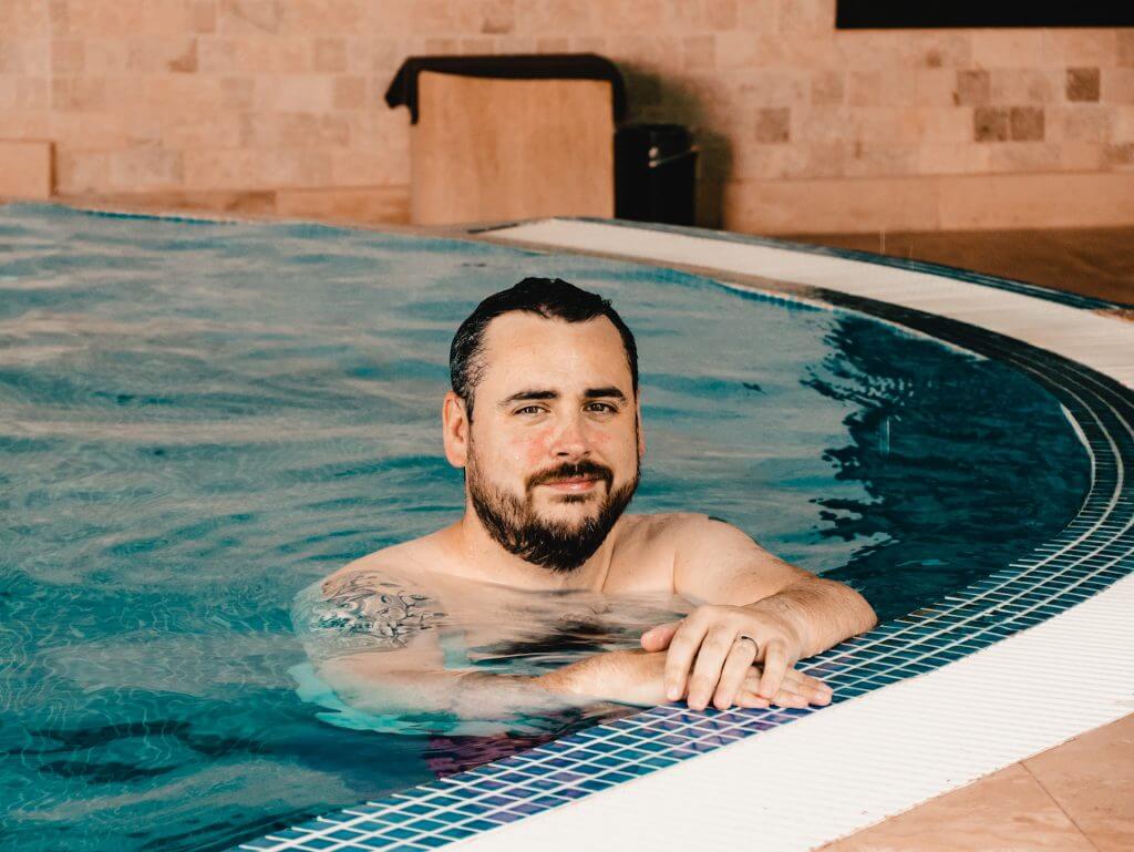 Man in a pool at The Wells Spa in Brooklodge Hotel Wicklow Ireland