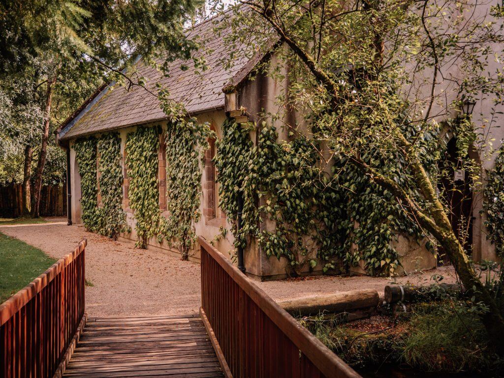 Small church covered in ivy on the grounds of Brooklodge Hotel in Ireland