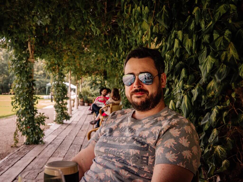 Man enjoying a pint of Guinness in Broolodge Hotel on his Irish staycation
