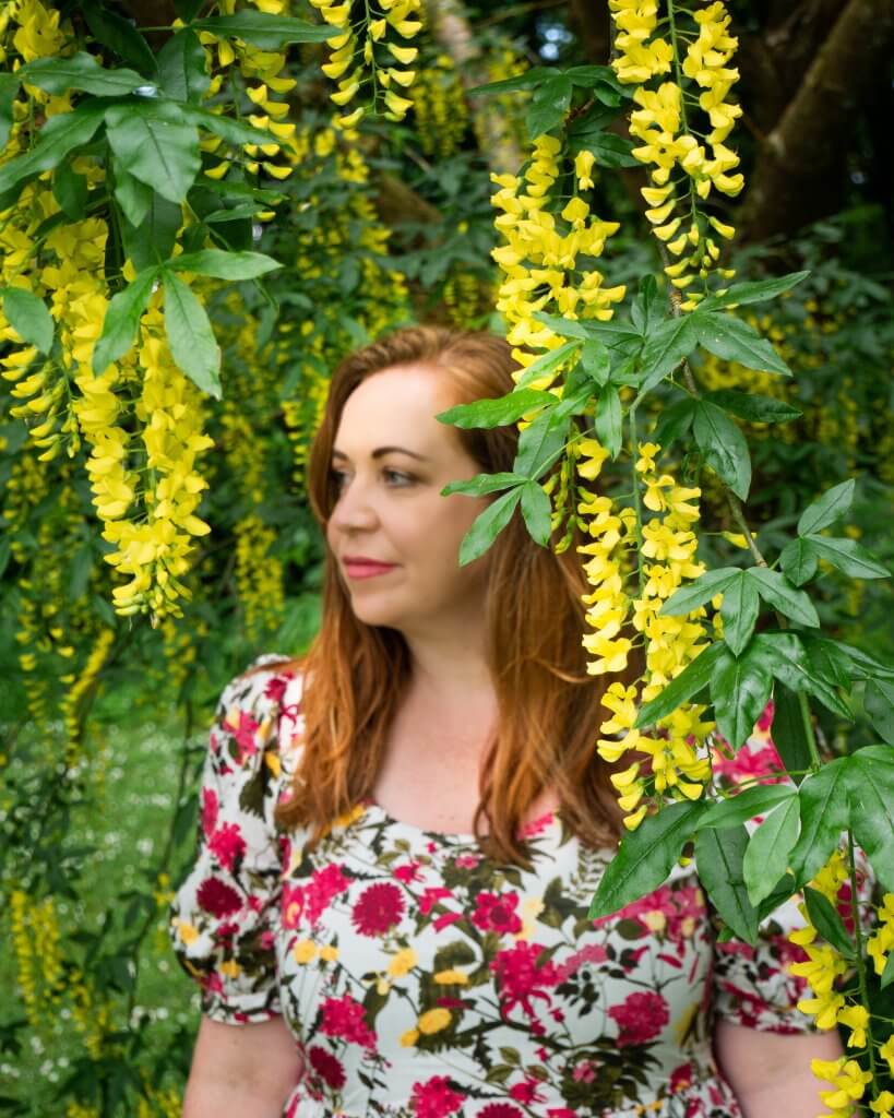 Woman in a flower dress at Mount Falcon estate in Ireland