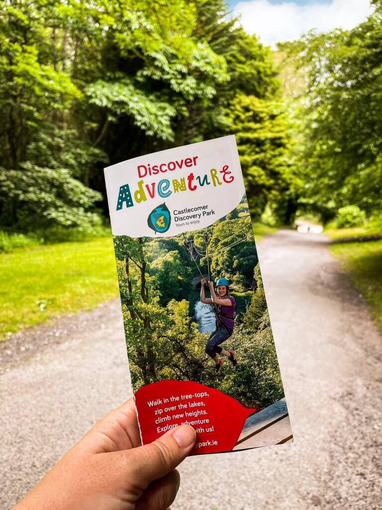 Woman holding a brochure of Castlecomer Discovery Park Kilkenny Ireland