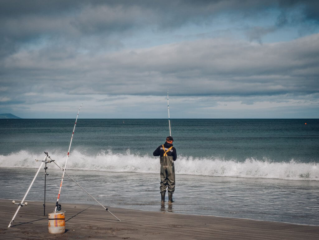 Fisherman at Ballygally Beach in Antrimm Northern Ireland