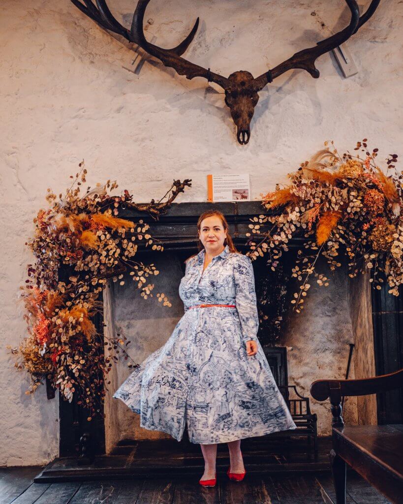 Woman in a blue dress exploring Rothe House and gardens on a weekend in Kilkenny Ireland