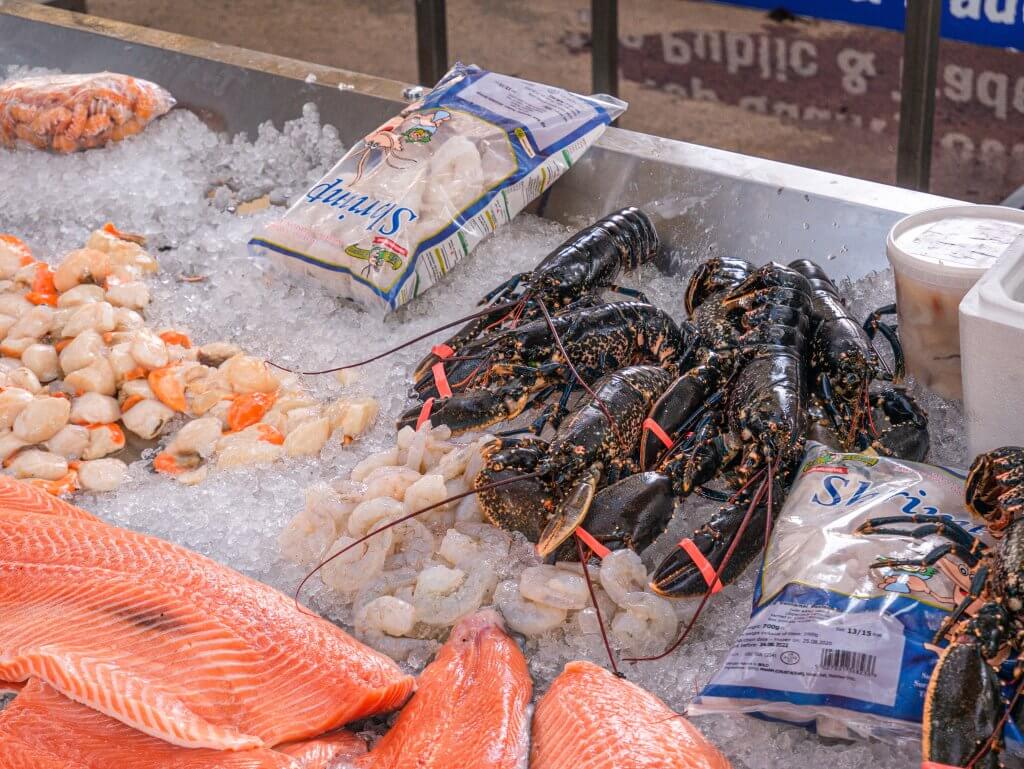 Fresh salmon and seafood on ice at a food stall in St. George's Market in Belfast City