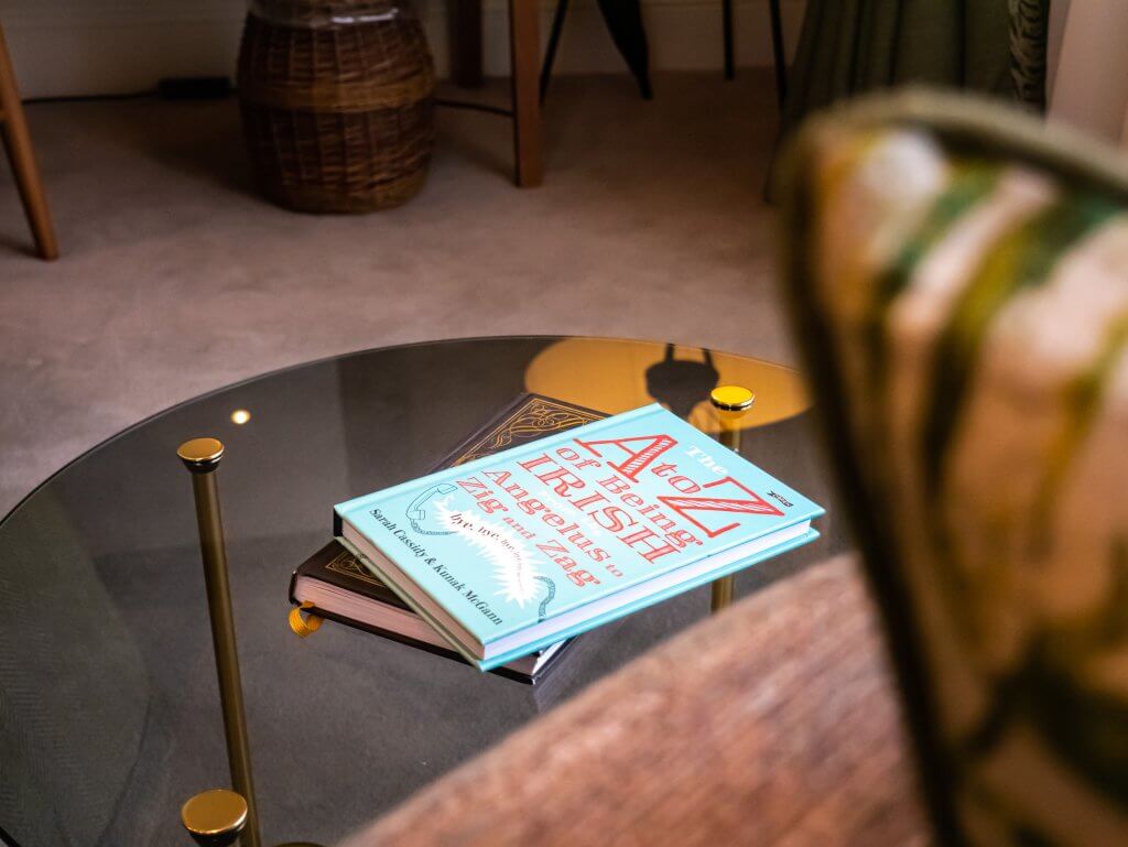 Reading book on a coffee table at Sheen Falls Lodge, Ireland.