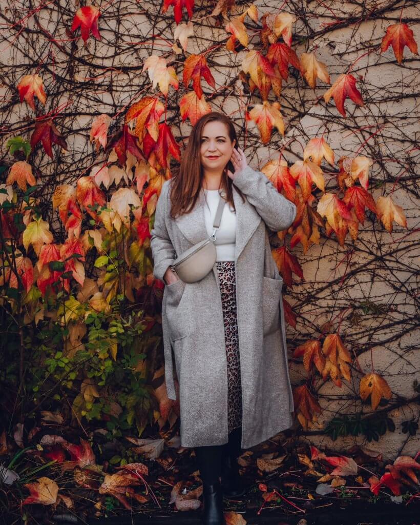 Woman standing beside autumn leaves at Sheen Falls Lodge Ireland