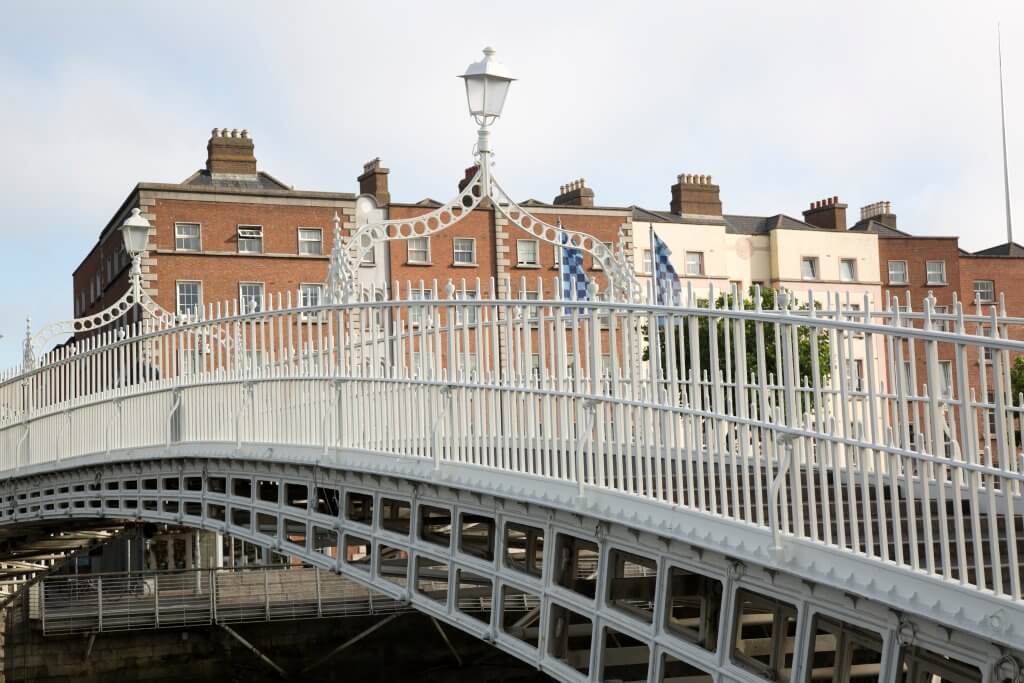 People crossing over the Ha'penny bridge in Dublin