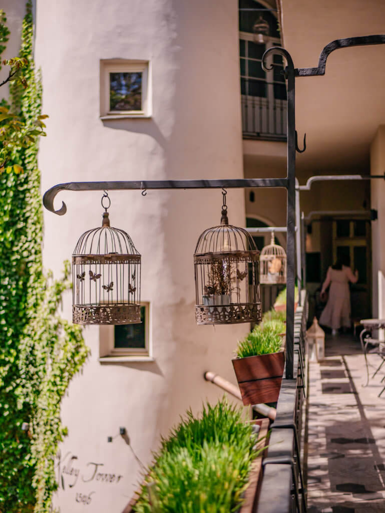 Woman walking into her room at MOOo by the castle apartments in Prague