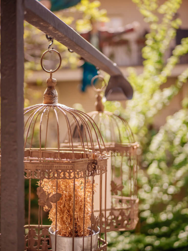 Birdcages with candles in the courtyard of the unique accommodation in Prague MOOo by the castle