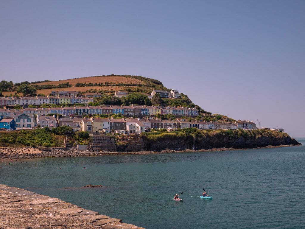 People kayaking in New Quay Cardigan Bay Wales