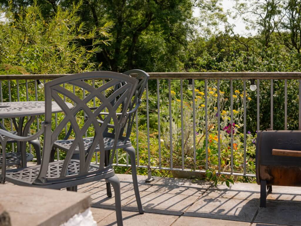 Outdoor seating area at Ty Nodyn converted barn in Wales