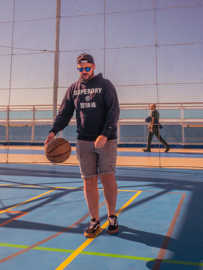 Man dribbling a basketball onboard Sky Princess Cruise Ship