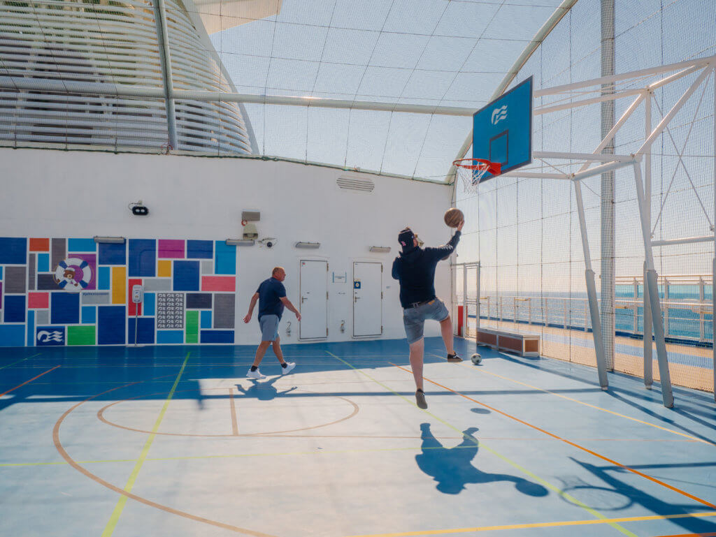 Men playing basketball onboard the Sky Princess Cruiseliner