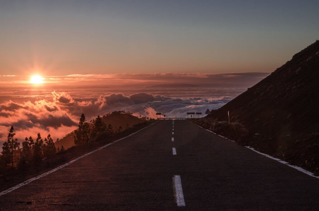 Road above the clouds at Mount Teide National Park. Driving in Tenerife on a Tenerife Road Trip