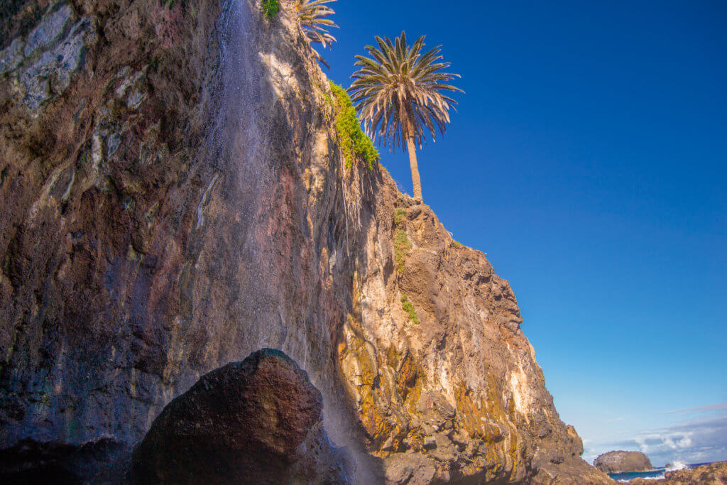 Waterfall falling directly onto the beach at Playa de Castro Tenerife