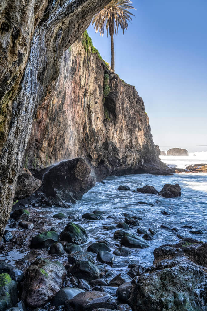 Rocky beach with a waterfall in Tenerife