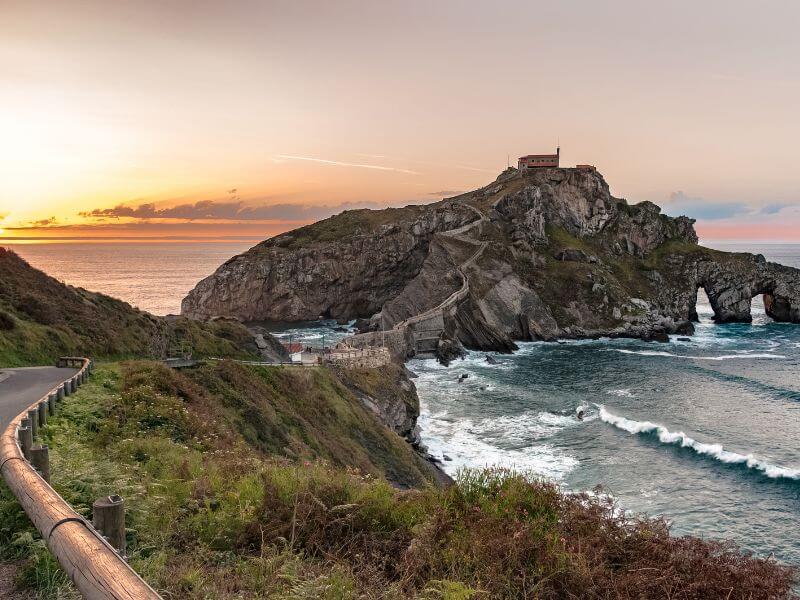 San Juan de Gaztelugatxe the filming location for Dragonstone in Game of Thrones at sunset.