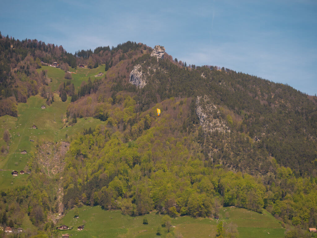 Person paragliding at Lake Lucerne
