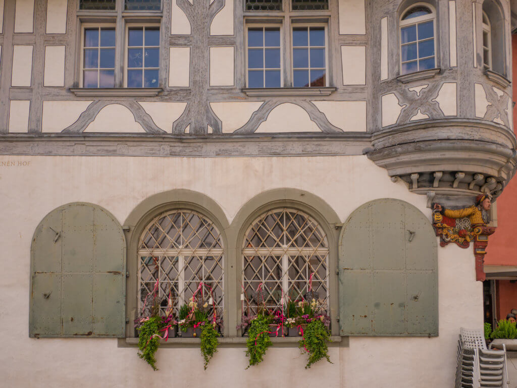Fairytale buildings and ornate oriel windows in St. Gallen Old Town Switzerland.