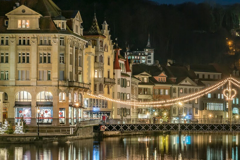 Lucerne city at night lit up by Christmas lights