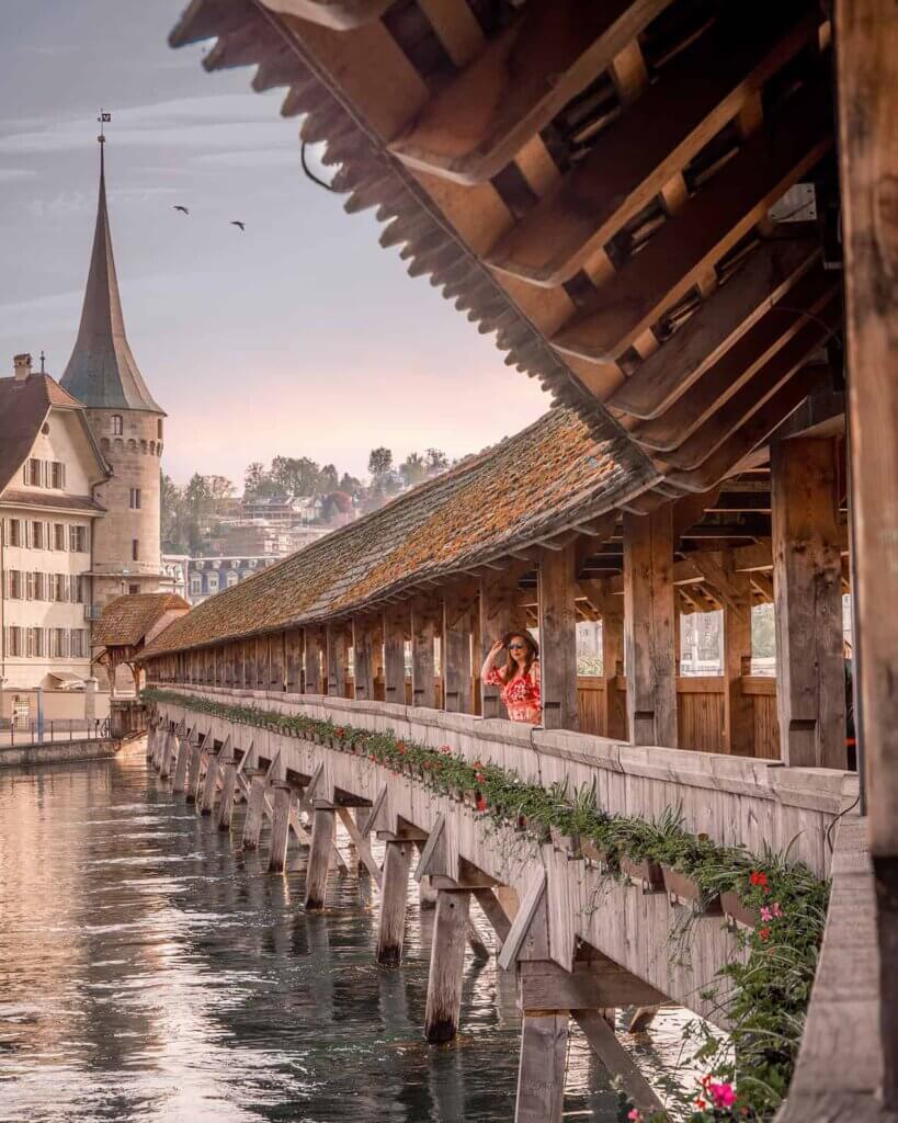 Nicola Lavin, travel blogger from Our Unique Stays, on chapel bridge in Lucerne on a paid press trip